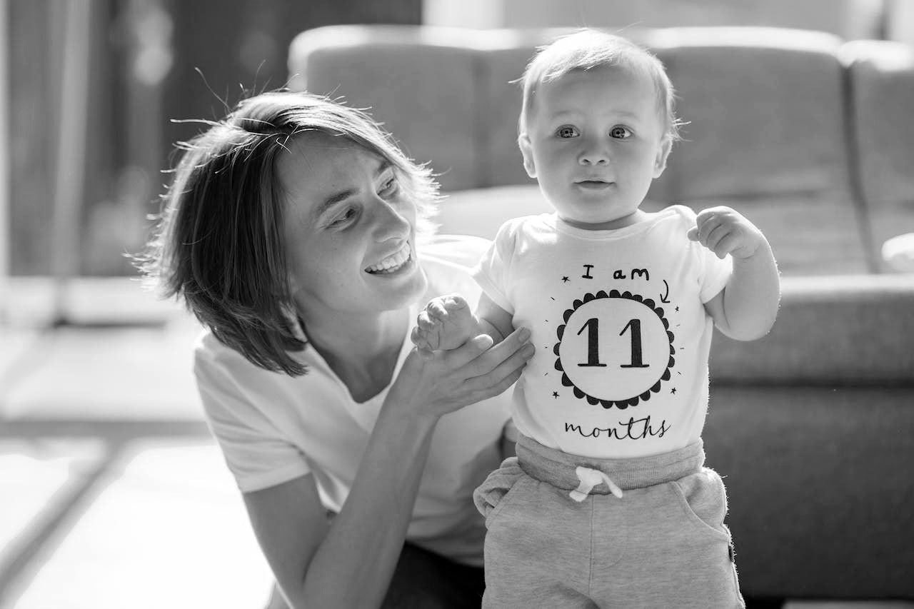 smiling mom with toddler
