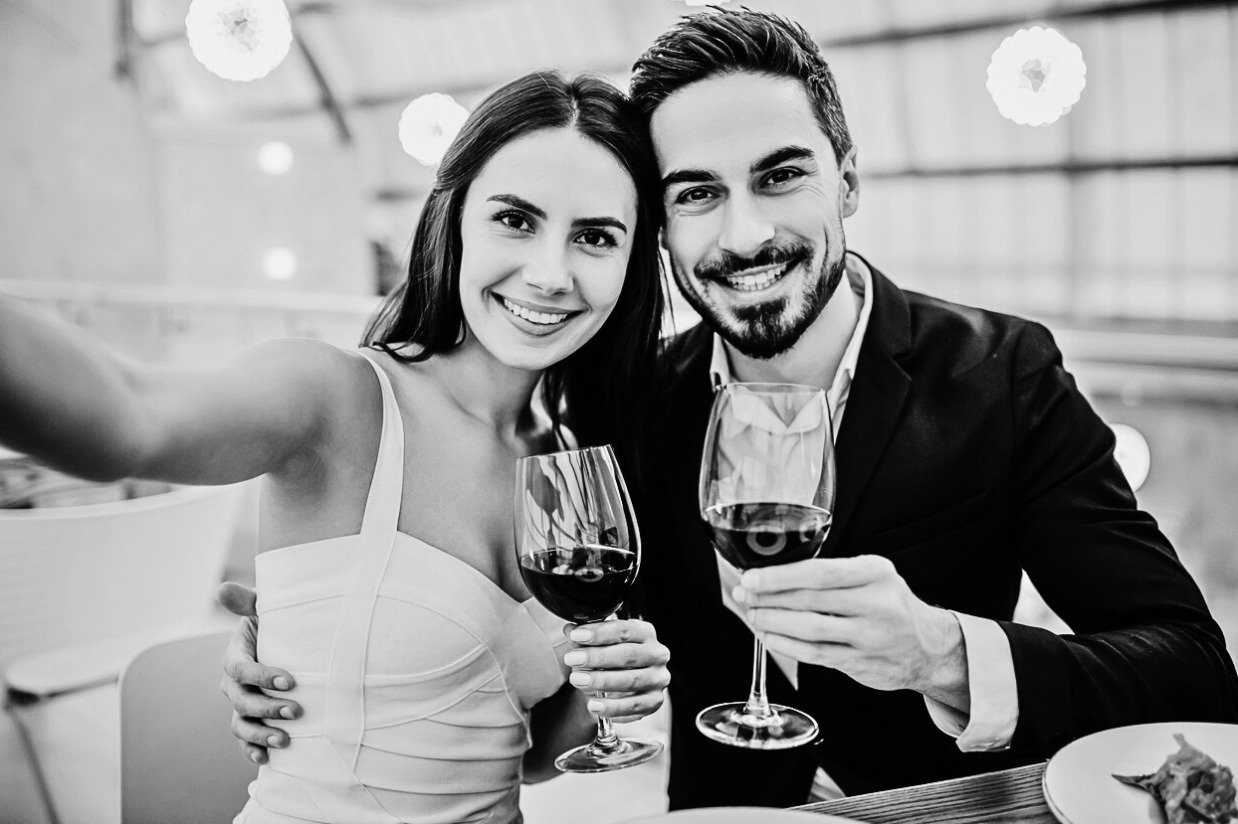 a couple smiling confidently on a date